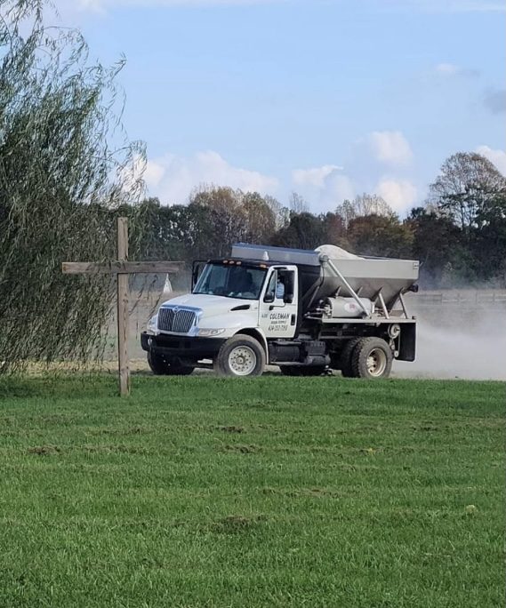 Lime being spread on a field